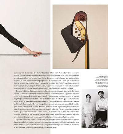 A photo of an article published by Forbes about the brand Studio DRÈA, its history, and founders. There is black text in a white background and a photo of the black lulu leather handbag from Studio DRÈA hanging on a bass. Right below it, there is a black and white photo of Studio DRÈA founders, Luiza and Isaac.