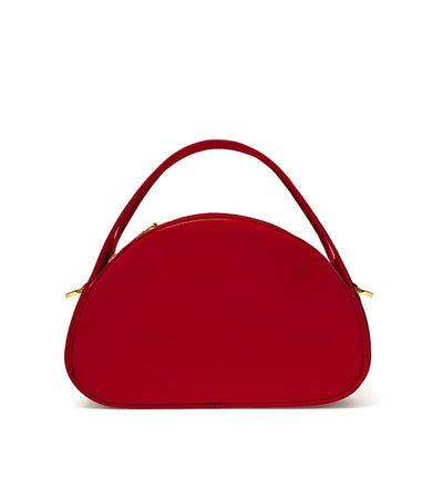 Red cherry leather handbag vanity case style from Studio DRÈA featured in the Marie Claire trends for 2026